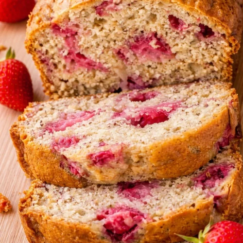 Delicious strawberry banana bread with fresh strawberries and ripe bananas.