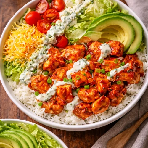 Delicious Buffalo Chicken Bowl with colorful toppings and spices