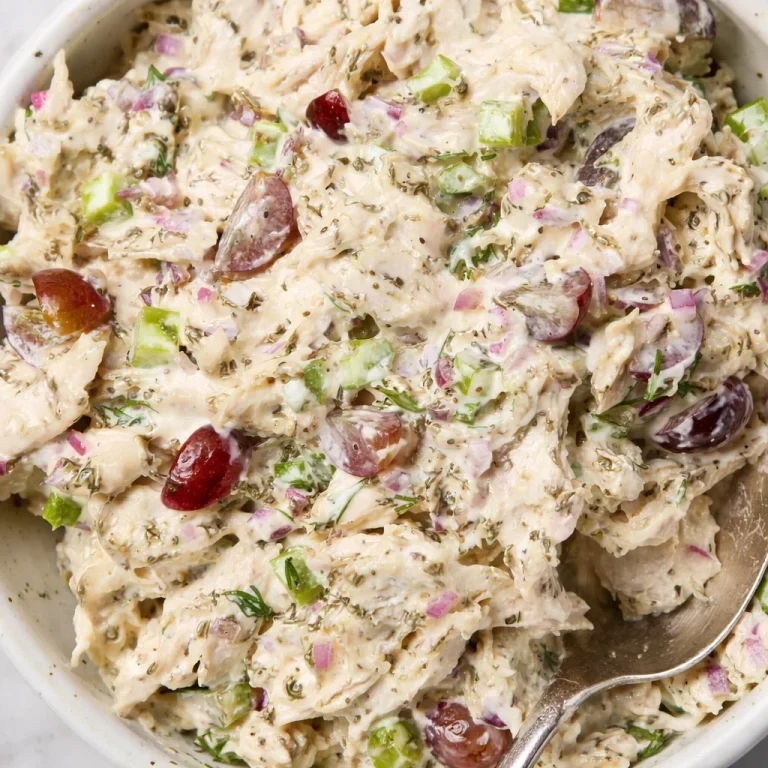 Delicious simple chicken salad recipe with mayo served in a bowl with fresh ingredients.