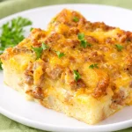 Simple breakfast casserole with sausage, eggs, cheese, and hashbrowns baked to perfection.