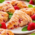 Freshly baked strawberry scones topped with a sweet vanilla glaze.
