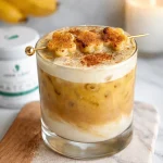 Delicious Banana Bread Latte topped with caramelized bananas and cold foam.