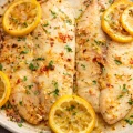 Baked tilapia fillets with lemon and garlic for a quick dinner option.